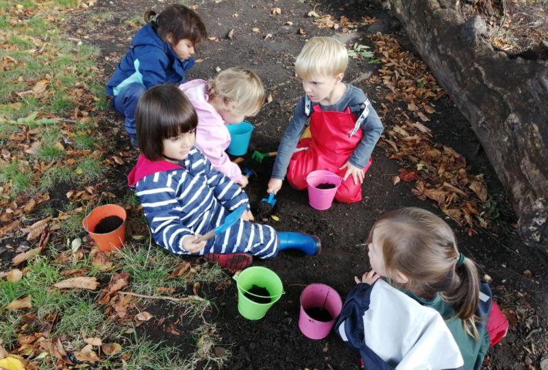 Our pupils playing outdoors, made possible by our nature-based approach